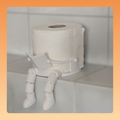 Toilettenpapierrollenhalter „Liest Buch“